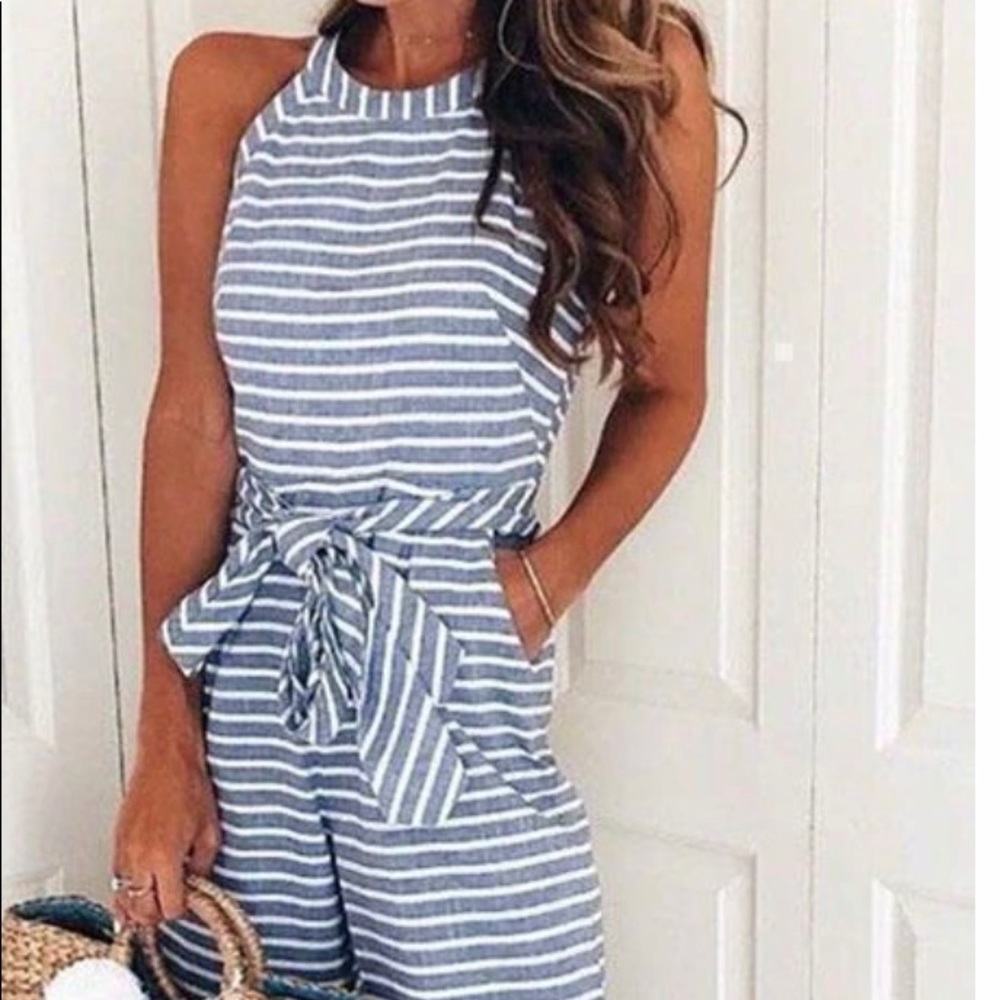 Adorable jumper. Zips in the back.  Ties at the waist.